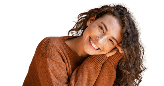 Woman smiling, holding her head with her hands