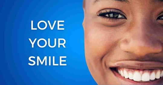 Close-up of a woman smiling, the words 'Love Your Smile' are on a blue background