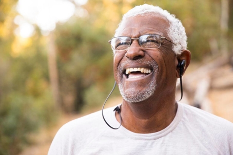 Older men with glasses smiling