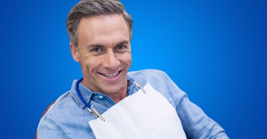 Man smiling in dentist chair