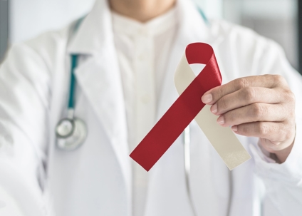 man holding a oral cancer ribbon