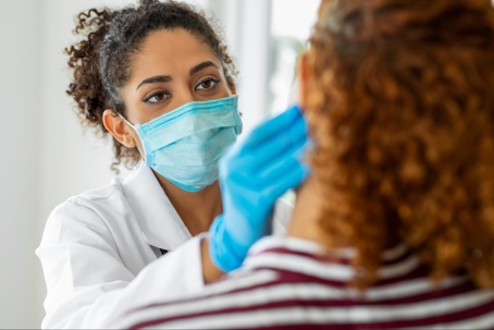 Female dentist examining a female patient
