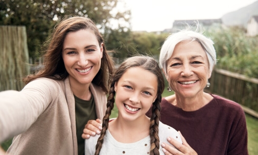 woman family members stand together